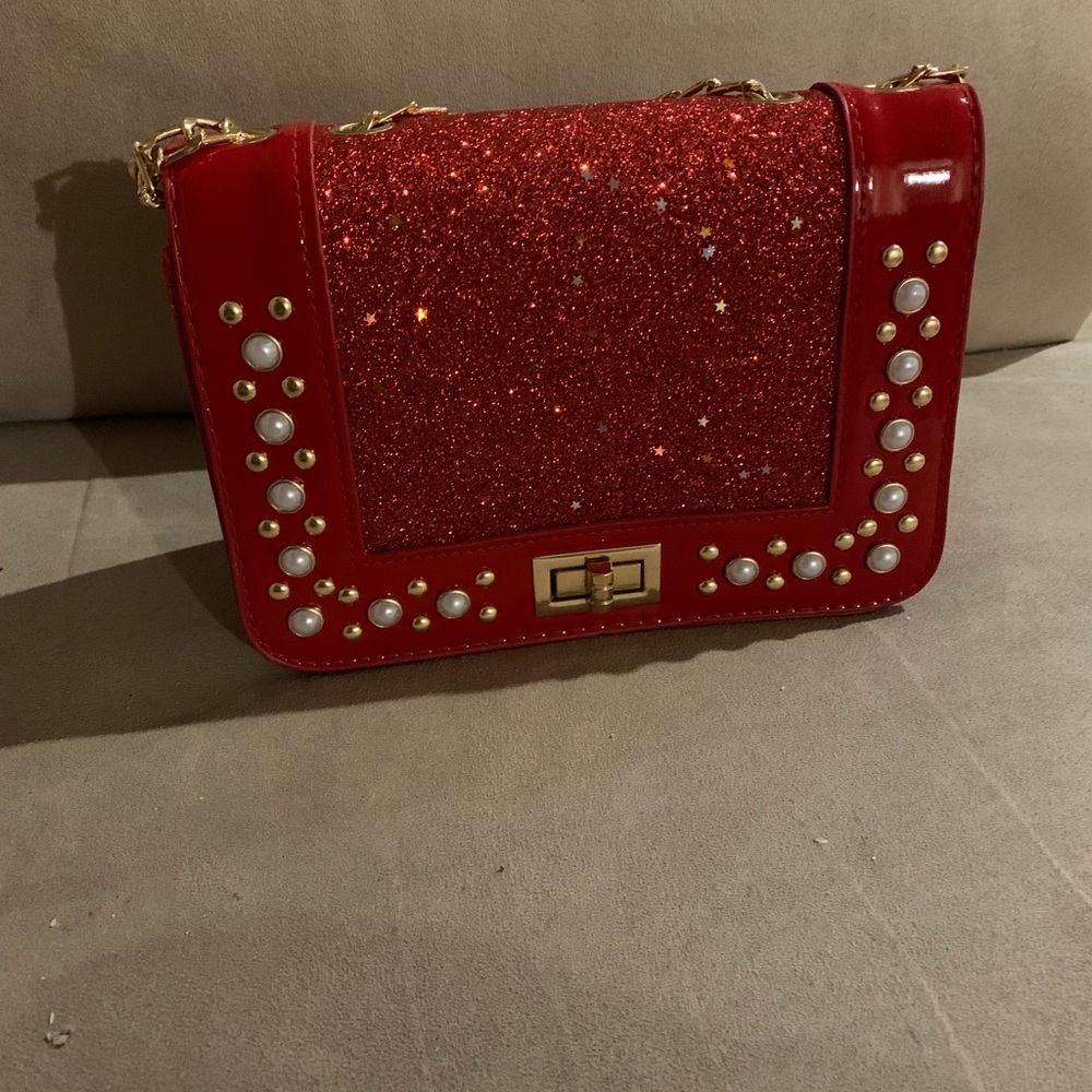 Nice red evening bag can be used as a clutch.